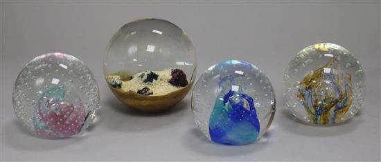 Three Caithness paperweights and one other